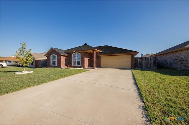 3907 Llano Estacado Ct, Killeen, TX 76549 - ranch-style home featuring brick siding, an attached garage, and driveway