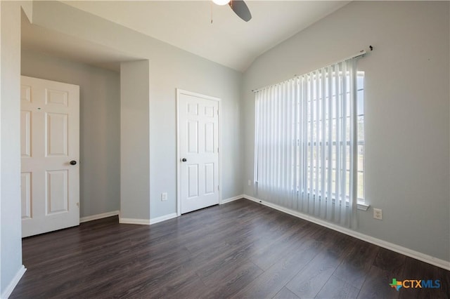 3907 Llano Estacado Ct, Killeen, TX 76549 - unfurnished bedroom featuring dark wood-type flooring, multiple windows, vaulted ceiling, and ceiling fan