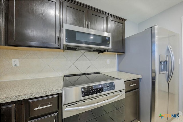 3907 Llano Estacado Ct, Killeen, TX 76549 - kitchen featuring stainless steel appliances, light countertops, dark brown cabinets, and backsplash