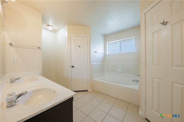 3907 Llano Estacado Ct, Killeen, TX 76549 - bathroom with a bath, tile patterned floors, and double vanity