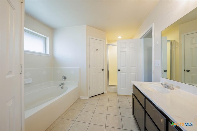 3907 Llano Estacado Ct, Killeen, TX 76549 - bathroom with tile patterned floors, a bath, vanity, and a shower stall
