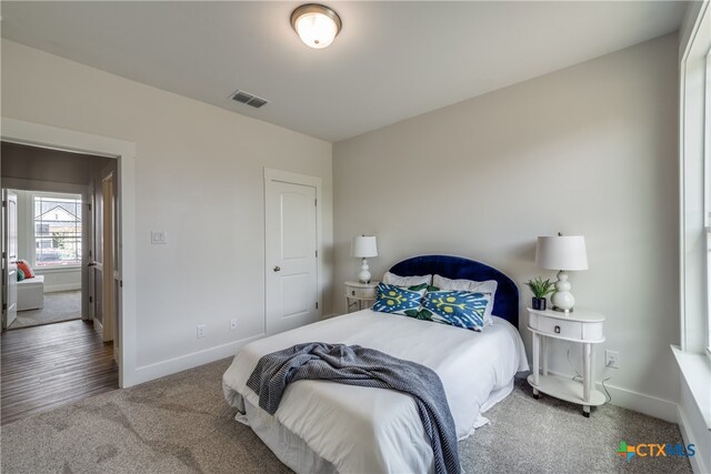 bedroom with wood-type flooring