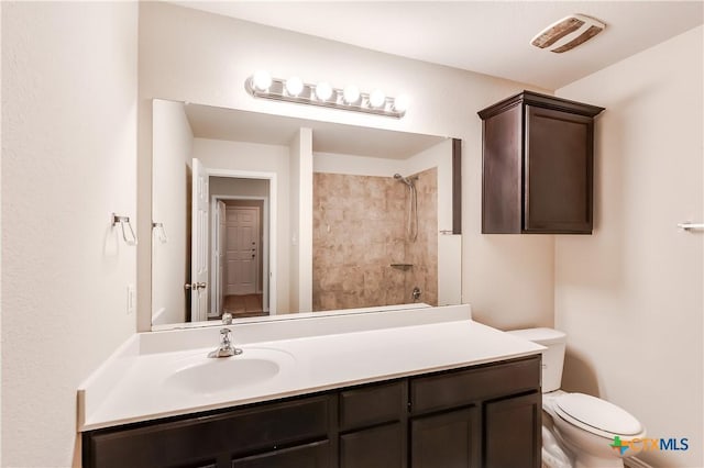 5402 Waterbank Ln, Killeen, TX 76543 - bathroom featuring a shower, toilet, and vanity