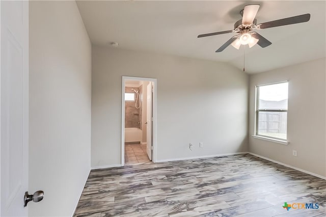 5402 Waterbank Ln, Killeen, TX 76543 - empty room with ceiling fan, light wood-style floors, lofted ceiling, and baseboards