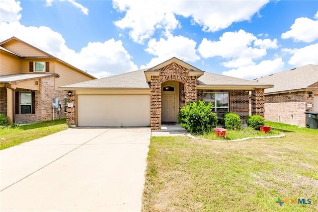 5402 Waterbank Ln, Killeen, TX 76543 - view of front of property with brick siding, an attached garage, a front lawn, and driveway
