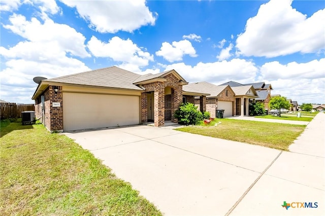 5402 Waterbank Ln, Killeen, TX 76543 - view of front of house featuring central AC, a garage, brick siding, and concrete driveway