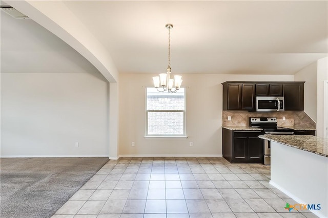 5402 Waterbank Ln, Killeen, TX 76543 - kitchen featuring stainless steel appliances, a chandelier, stone countertops, tasteful backsplash, and light tile patterned floors