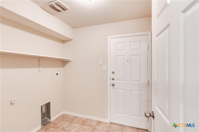 5402 Waterbank Ln, Killeen, TX 76543 - clothes washing area featuring hookup for an electric dryer, baseboards, and light tile patterned flooring
