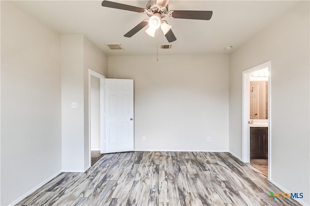 5402 Waterbank Ln, Killeen, TX 76543 - unfurnished bedroom featuring light wood finished floors, baseboards, ensuite bath, and ceiling fan