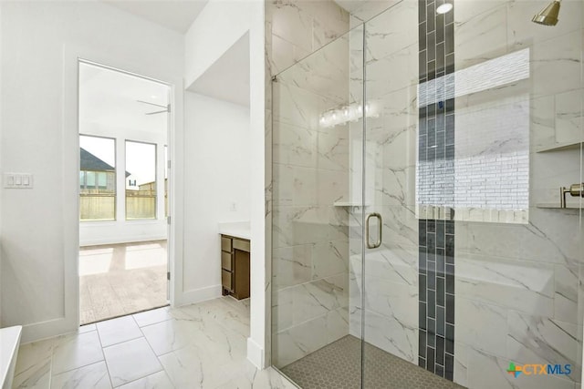 bathroom with vanity and a shower with door