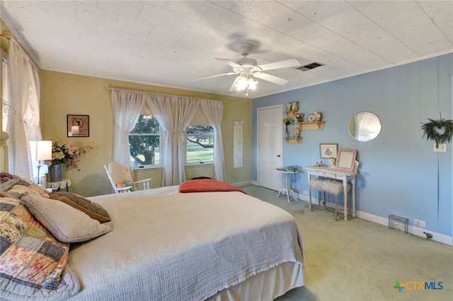 bedroom with visible vents, baseboards, a ceiling fan, and carpet flooring