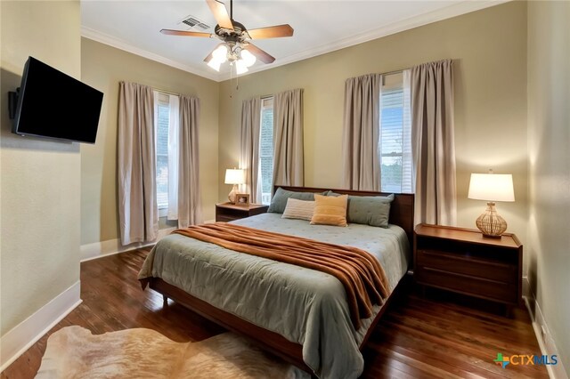 bedroom featuring dark wood-type flooring, ceiling fan, and crown molding