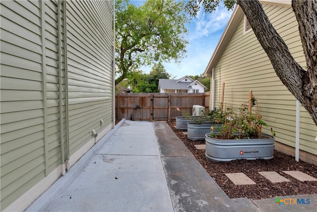 view of side of home with a patio