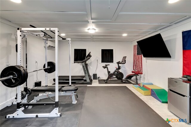 workout area featuring an AC wall unit