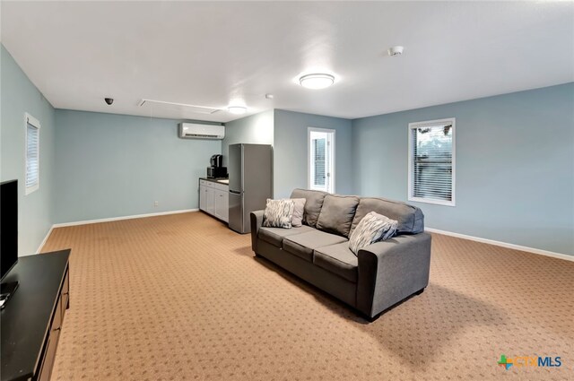 carpeted living room with a wall unit AC