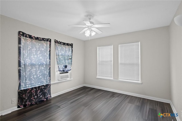 unfurnished room featuring baseboards, cooling unit, a ceiling fan, and dark wood-type flooring