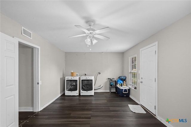 laundry area featuring visible vents, laundry area, dark wood-style floors, washing machine and clothes dryer, and a ceiling fan