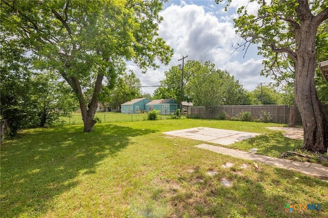 view of yard with a patio and a fenced backyard