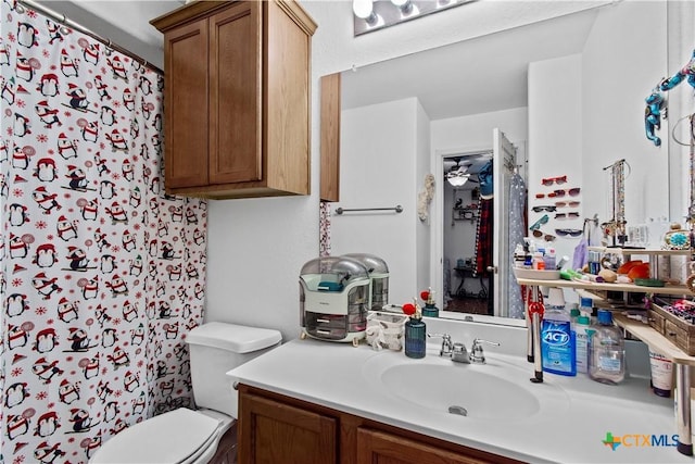 bathroom featuring toilet and vanity