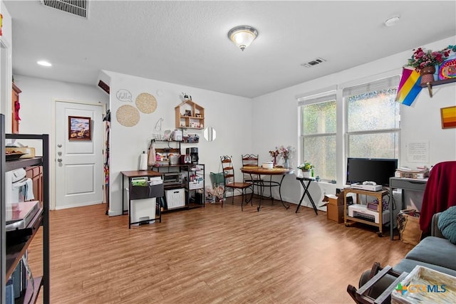 office with visible vents, recessed lighting, and light wood-type flooring