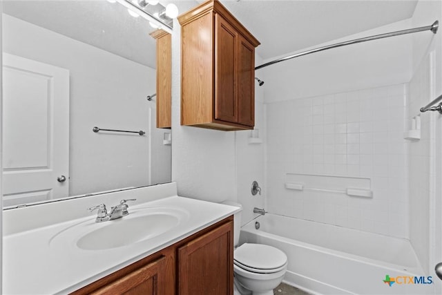 bathroom with vanity, bathtub / shower combination, and toilet