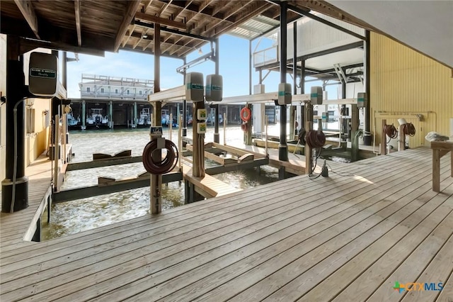 view of dock with a water view and boat lift