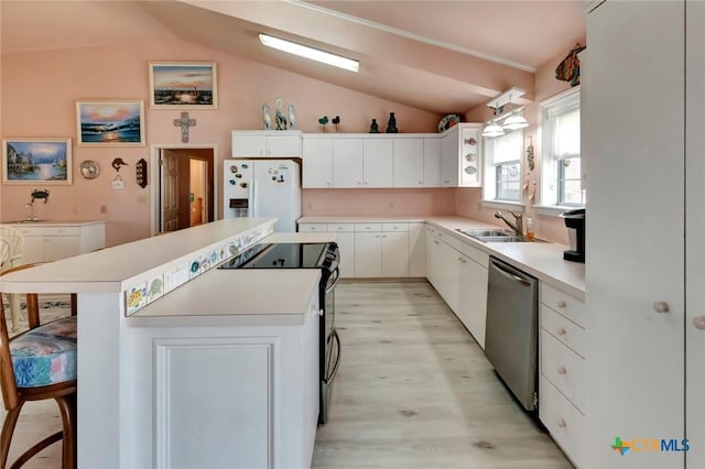 kitchen with white refrigerator with ice dispenser, range with electric stovetop, a kitchen island, a sink, and dishwasher