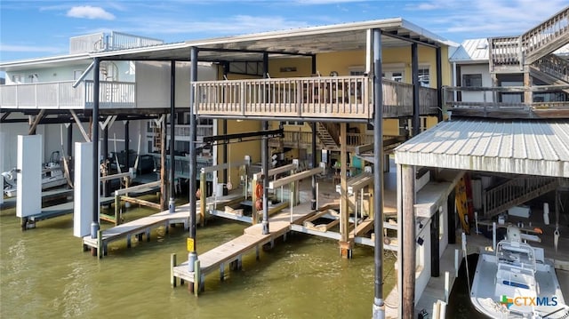 view of dock with a water view and boat lift