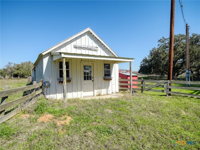 view of outdoor structure featuring fence