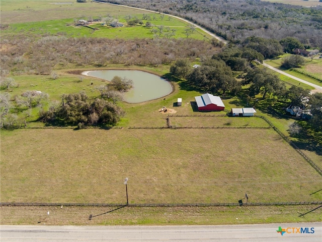 aerial view with a rural view and a water view