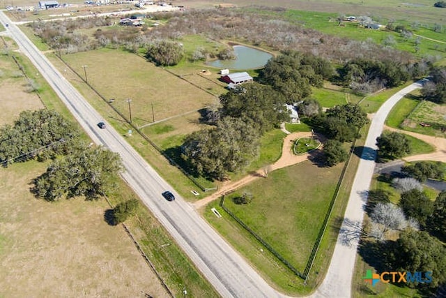 birds eye view of property with a rural view