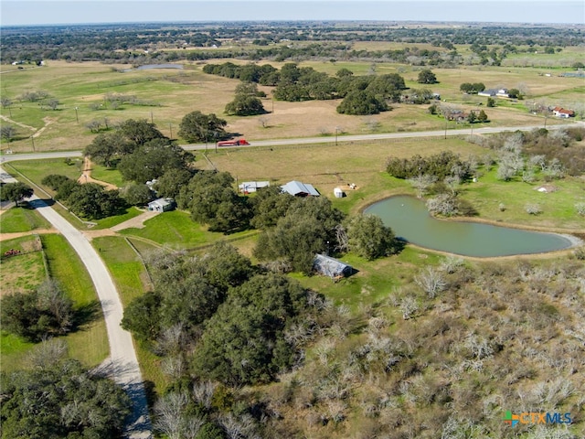 drone / aerial view featuring a rural view and a water view