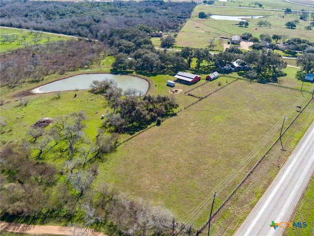 drone / aerial view featuring a rural view and a water view