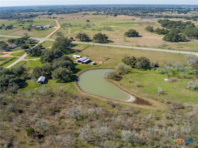 bird's eye view featuring a rural view and a water view