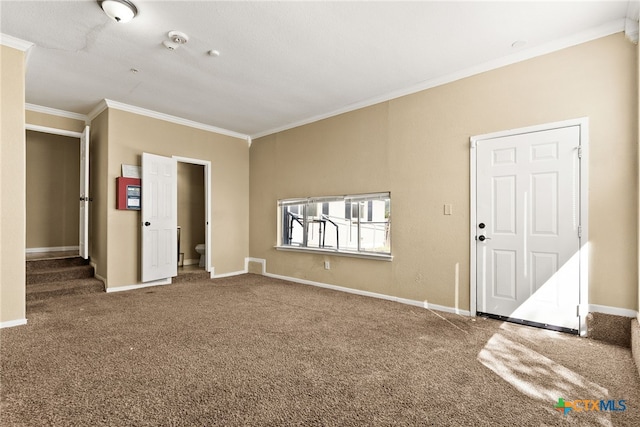 interior space featuring stairway, baseboards, and ornamental molding