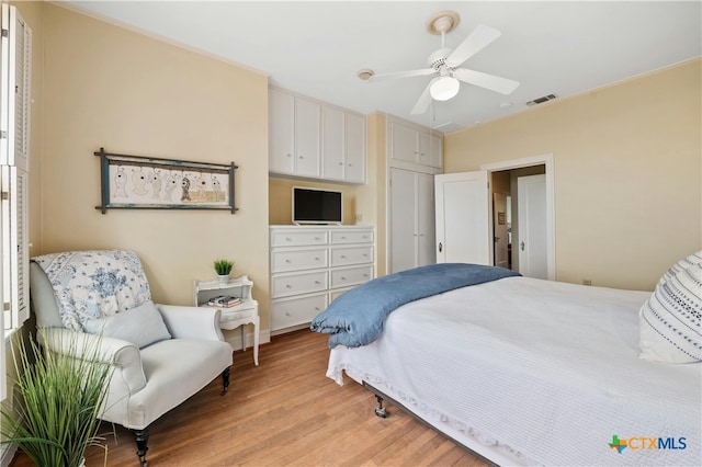 601 Lakewood Dr, Burnet, TX 78611 - bedroom with visible vents, a ceiling fan, and light wood-type flooring