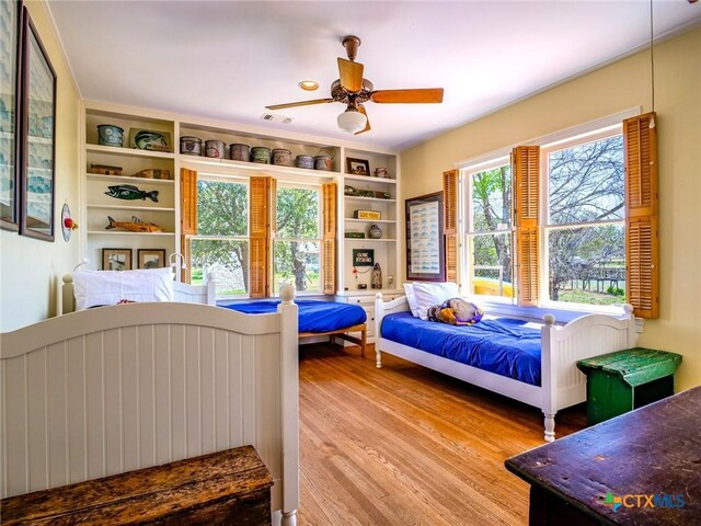 601 Lakewood Dr, Burnet, TX 78611 - bedroom featuring ceiling fan, visible vents, and light wood-type flooring