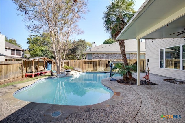 view of swimming pool with a patio