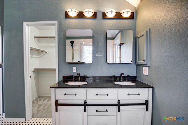 bathroom featuring vanity and lofted ceiling