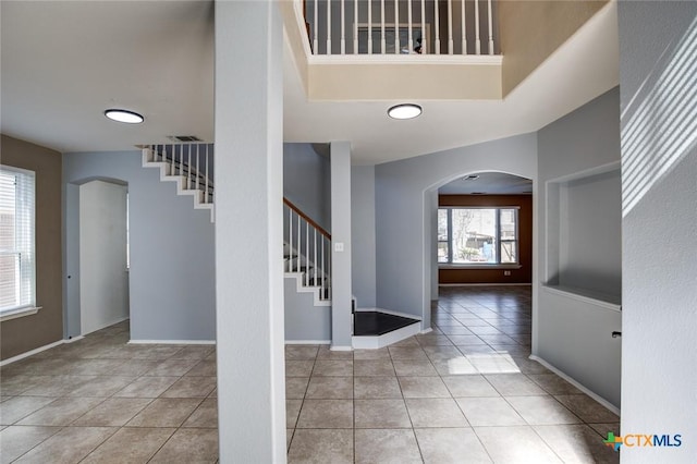 entrance foyer with light tile patterned floors