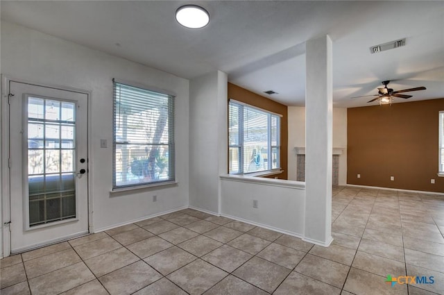 interior space featuring ceiling fan