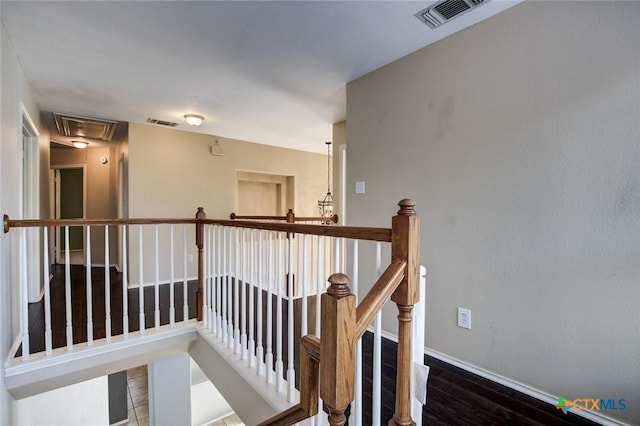 hall with hardwood / wood-style flooring