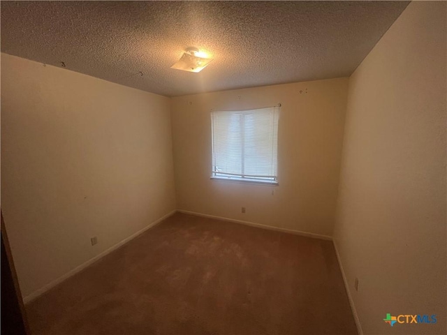 2402 Lago Trl, Killeen, TX 76543 - unfurnished room featuring carpet flooring, a textured ceiling, and baseboards