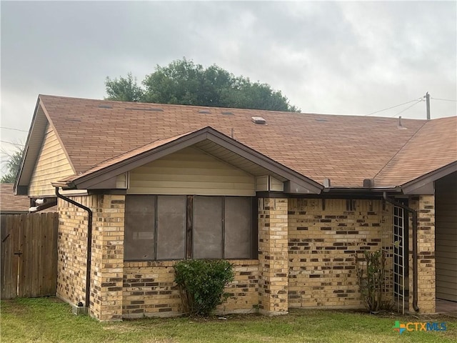 2402 Lago Trl, Killeen, TX 76543 - view of home's exterior featuring roof with shingles and brick siding