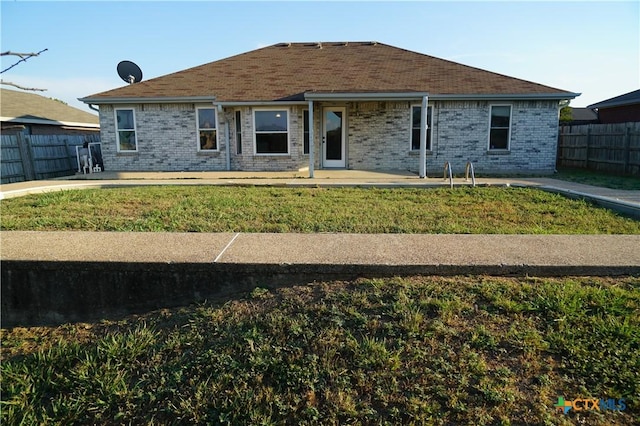 ranch-style house with a front lawn