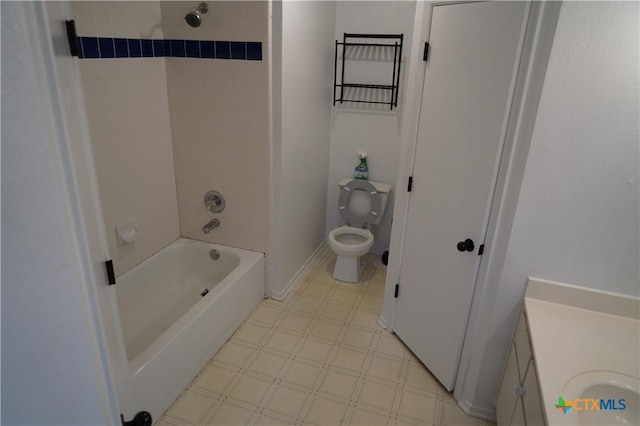 full bathroom with vanity, toilet, and tiled shower / bath