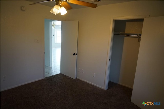 unfurnished bedroom featuring a closet, ceiling fan, and light colored carpet