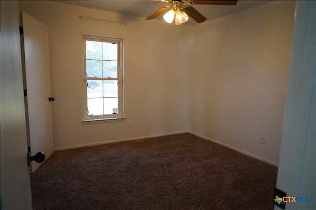 carpeted spare room with ceiling fan