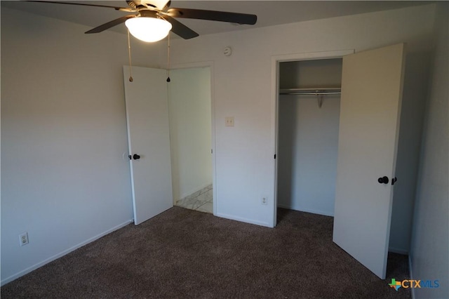 unfurnished bedroom with ceiling fan, carpet floors, and a closet