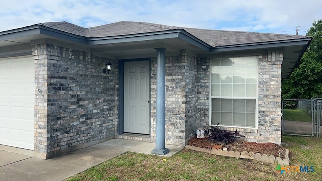 property entrance with a garage